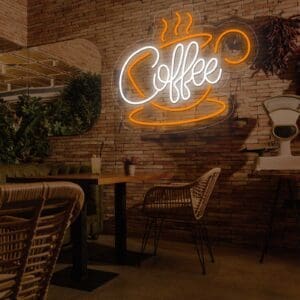 Una cafetería con un cartel de Neón Coffe con Taza en la pared.